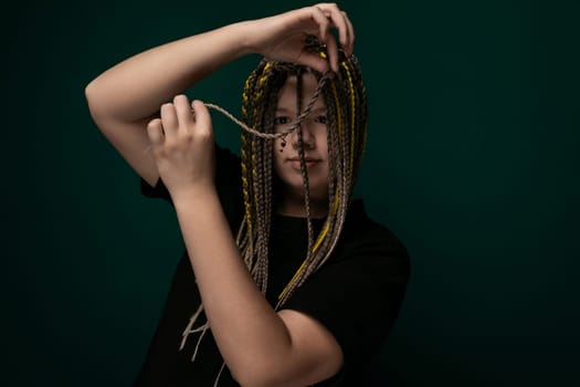 A woman is shown with a large, voluminous amount of hair gathered on top of her head. The hair appears thick, full, and styled in a bundle, creating a distinctive look.