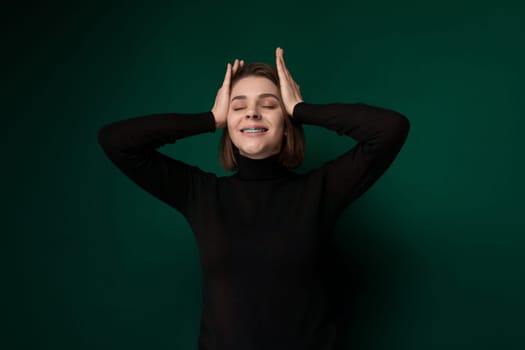 A woman is shown with her hands gripping her head in a gesture of frustration or distress. She appears visibly stressed, with a pained expression on her face.