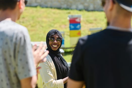 A diverse group of young friends and entrepreneurs explore small honey production businesses in the natural setting of the countryside