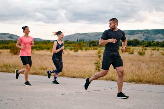 A professional athletic team as they train rigorously, running towards peak performance in preparation for an upcoming marathon.