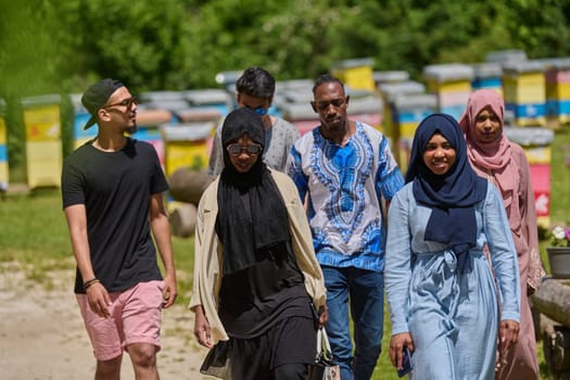 A diverse group of young friends and entrepreneurs explore small honey production businesses in the natural setting of the countryside