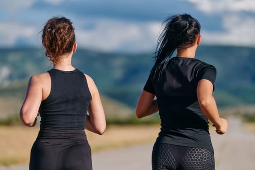 Two friends jog side by side on a sunny day, strengthening their bodies for life's extreme challenges, embodying the power of friendship and determination