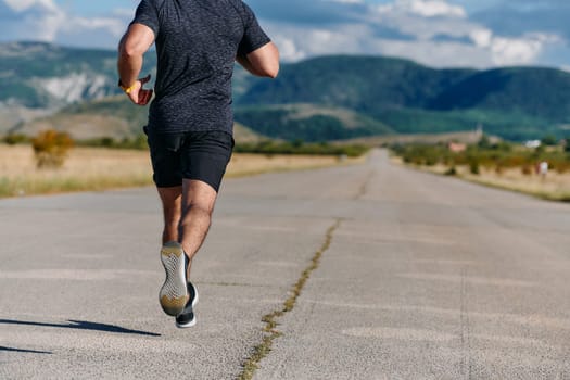 An athletic man jogs under the sun, conditioning his body for life's extreme challenges, exuding determination and strength in his preparation for the journey ahead