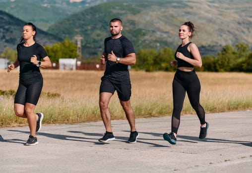 A professional athletic team as they train rigorously, running towards peak performance in preparation for an upcoming marathon.