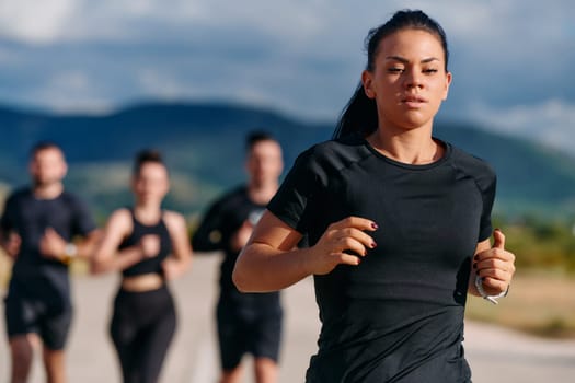 A professional athletic team as they train rigorously, running towards peak performance in preparation for an upcoming marathon.