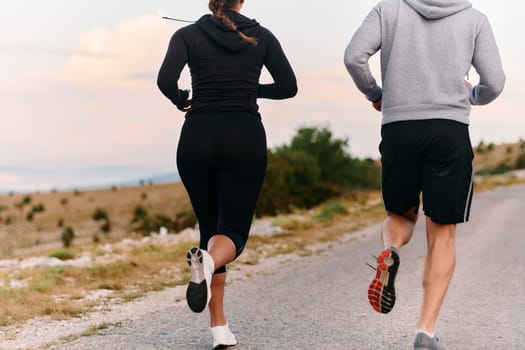 Couple conquer challenging mountain trails during an invigorating morning run.