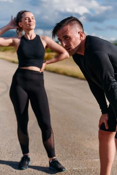 After a vigorous morning run, a couple finds solace and relaxation, basking in the quietude of their post exercise tranquility.