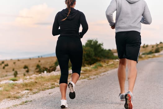 Couple conquer challenging mountain trails during an invigorating morning run.