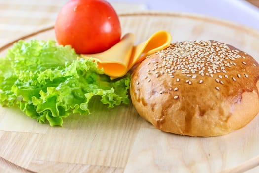 cheeseburger ingredients on wooden background 3