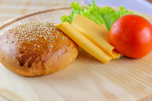 cheeseburger ingredients on wooden background 1