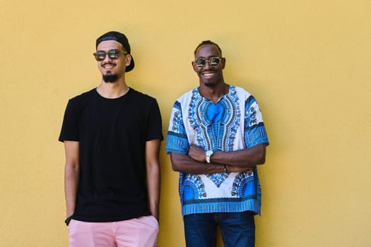 A depiction of camaraderie and cultural diversity two male friends, one an African American teenager dressed in Sudanese traditional attire, leaning against a vibrant yellow wall