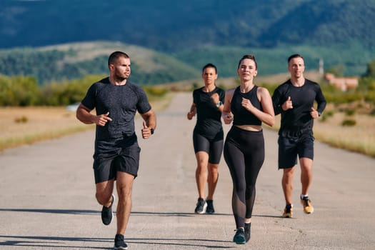 A professional athletic team as they train rigorously, running towards peak performance in preparation for an upcoming marathon.