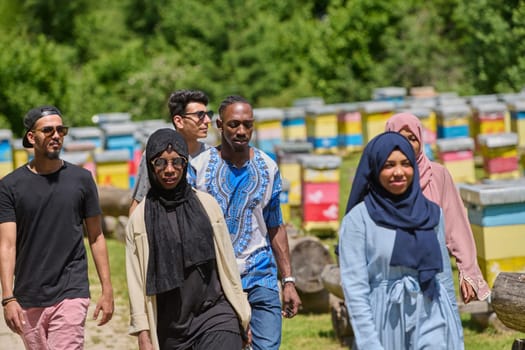 A diverse group of young friends and entrepreneurs explore small honey production businesses in the natural setting of the countryside