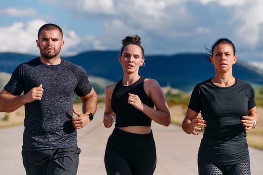 A professional athletic team as they train rigorously, running towards peak performance in preparation for an upcoming marathon.