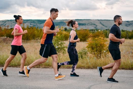 A professional athletic team as they train rigorously, running towards peak performance in preparation for an upcoming marathon.