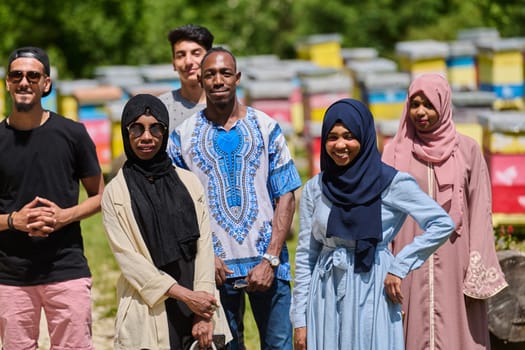 A diverse group of young friends and entrepreneurs explore small honey production businesses in the natural setting of the countryside