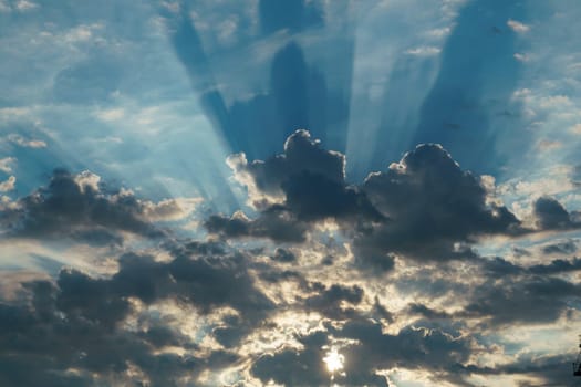 Stormy sky with dramatic clouds from an approaching thunderstorm at sunset Dramatic sky with cirrus and cumulus clouds under the blue sky before rain. Idyllic summer scene. Panoramic view. Recreation, ecotourism, nature in Italy, High quality photo