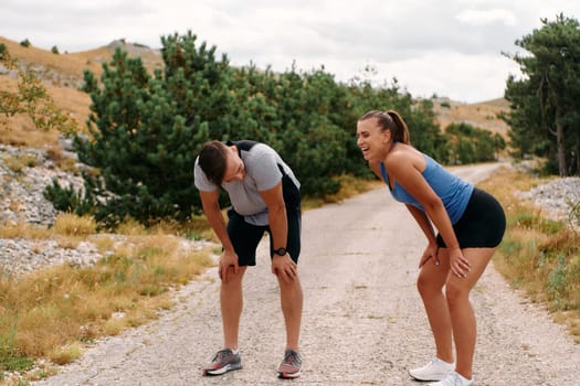 A romantic couple enjoys a serene moment of rest and affection after their morning run, basking in the glow of their shared fitness journey