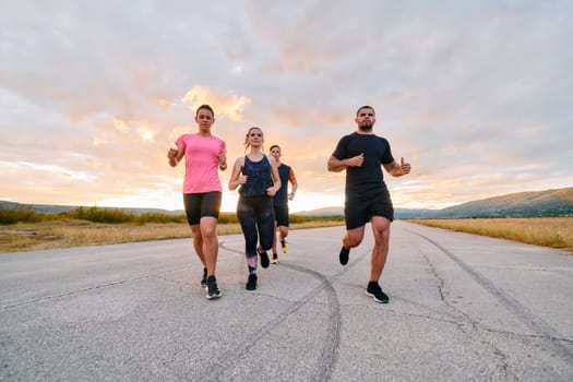 A professional athletic team as they train rigorously, running towards peak performance in preparation for an upcoming marathon.