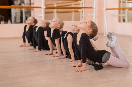 Five little girls doing basket exercise