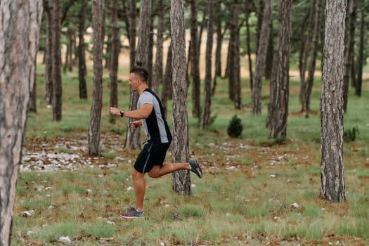 An unwavering man dashes through perilous forest paths, skillfully hurdling over wooden obstacles with determination and agility, epitomizing courage and athleticism