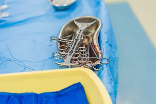 Used medical instruments of a surgeon in the operating room during an operation.