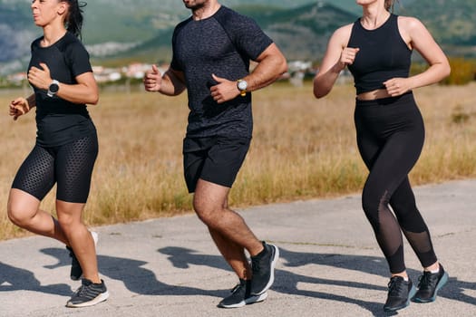 A professional athletic team as they train rigorously, running towards peak performance in preparation for an upcoming marathon.