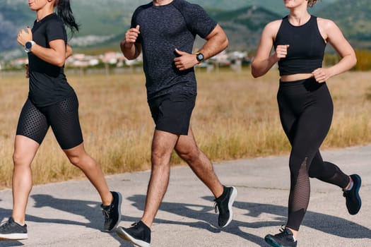 A professional athletic team as they train rigorously, running towards peak performance in preparation for an upcoming marathon.