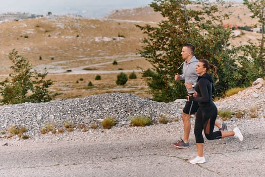 Couple conquer challenging mountain trails during an invigorating morning run.