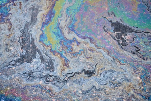 Slick industry oil fuel spilling water pollution. Water with patches of gasoline and oil
