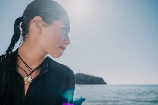 Woman travel sea. Young Happy woman posing on a beach near the sea on background of volcanic rocks, like in Iceland, sharing travel adventure journey