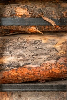 Front view of log wall mounted with wrought iron