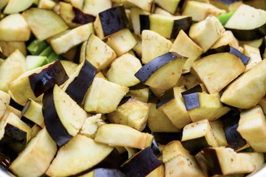 Top view of eggplants being diced for frying