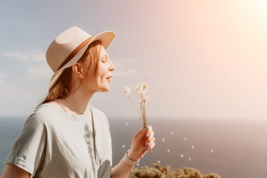 Woman travel sea. Happy carefree sensual woman with long hair in black swimwear posing at sunset beach. Silhouette of young beautiful playful positive woman outdoor. Summer vacation and trip concept