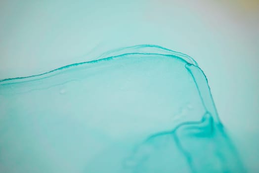 The picture is painted in alcohol ink. Abstraction will perfectly fit into a modern interior. Closeup of the painting. Colorful abstract painting background. Highly-textured paint.