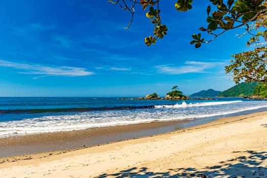 Remote wild beach of Castelhanos and its paradisiacal tropical landscape on the island of Ilhabela in Sao Paulo