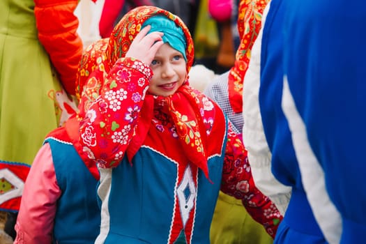 VICHUGA, RUSSIA - MARCH 12, 2016: Celebration of the Russian Slavic holiday of Maslenitsa. A girl in a traditional costume