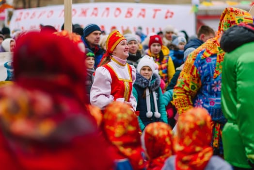 VICHUGA, RUSSIA - MARCH 12, 2016: Celebration of the Russian Slavic holiday of Maslenitsa. A woman in a traditional costume