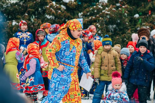 VICHUGA, RUSSIA - FEBRUARY 17, 2018: Contests and entertainment on stage at the traditional winter Russian Slavic celebration of the Maslenitsa holiday