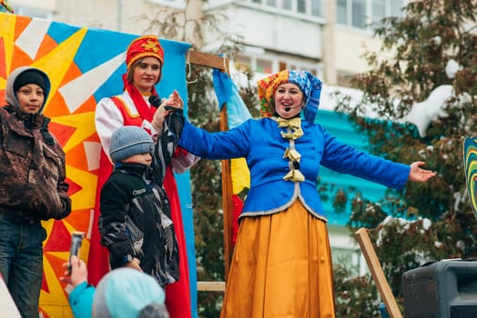 VICHUGA, RUSSIA - FEBRUARY 17, 2018: Contests and entertainment on stage at the traditional winter Russian Slavic celebration of the Maslenitsa holiday