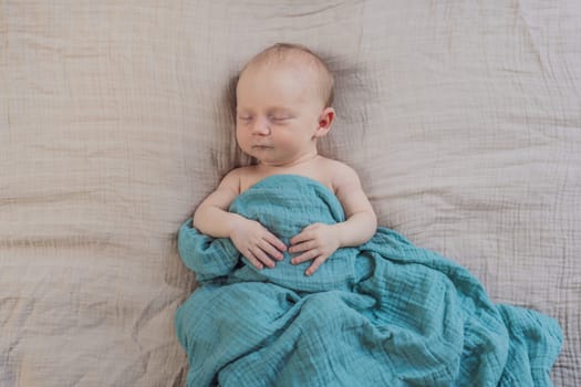 The baby is sleeping peacefully in his cozy nest. Newborn photo session captures the serene innocence and warmth of early moments.
