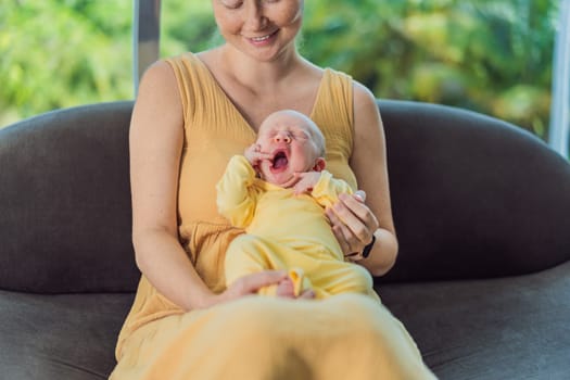 Mom with newborn baby relaxing on the sofa at home. This tender moment highlights the bond between mother and child in a comfortable and loving family environment.