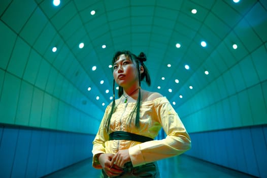 Portrait of an Asian young woman in a subway crossing