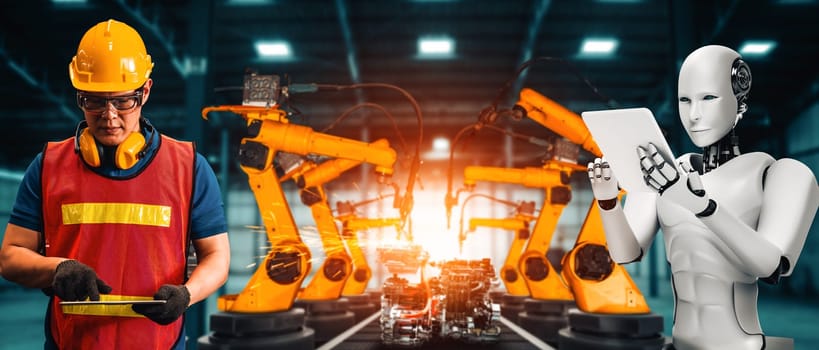 MLB Mechanized industry robot and human worker working together in future factory. Concept of artificial intelligence for industrial revolution and automation manufacturing process.