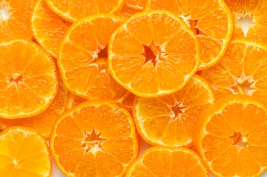 studio photo of cut tangerines as a background 3