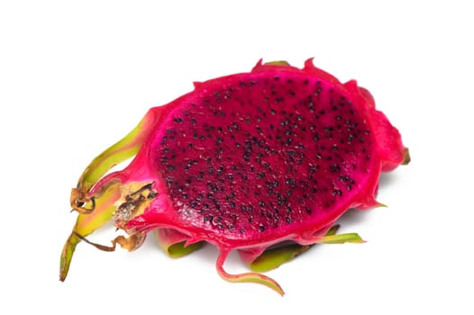 Close up of whole and halved Dragon Fruit or Pitahaya/Pitaya on pale pink background 1