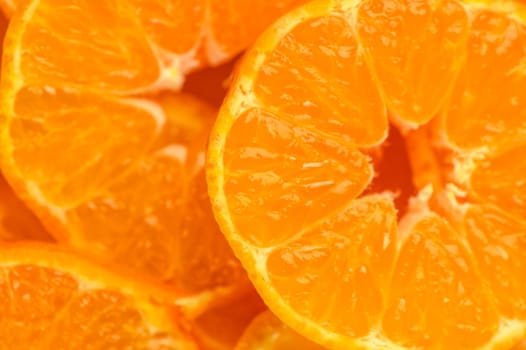 Texture of sweet cut tangerines as background 1