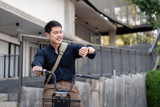 Businessman on a bicycle checking his watch, promoting eco-friendly commuting and modern work-life balance.