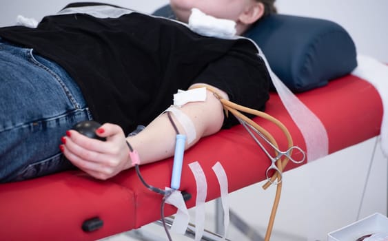 view of donor giving blood at donation center.