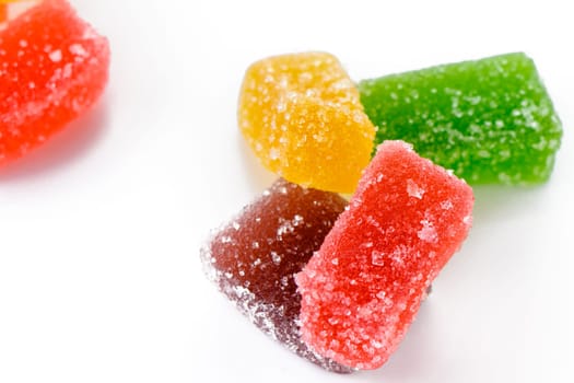 Sweet delicious multi-colored marmalade or jelly candies assorted in sugar sprinkles with fruit and berry flavor on a white background. 2